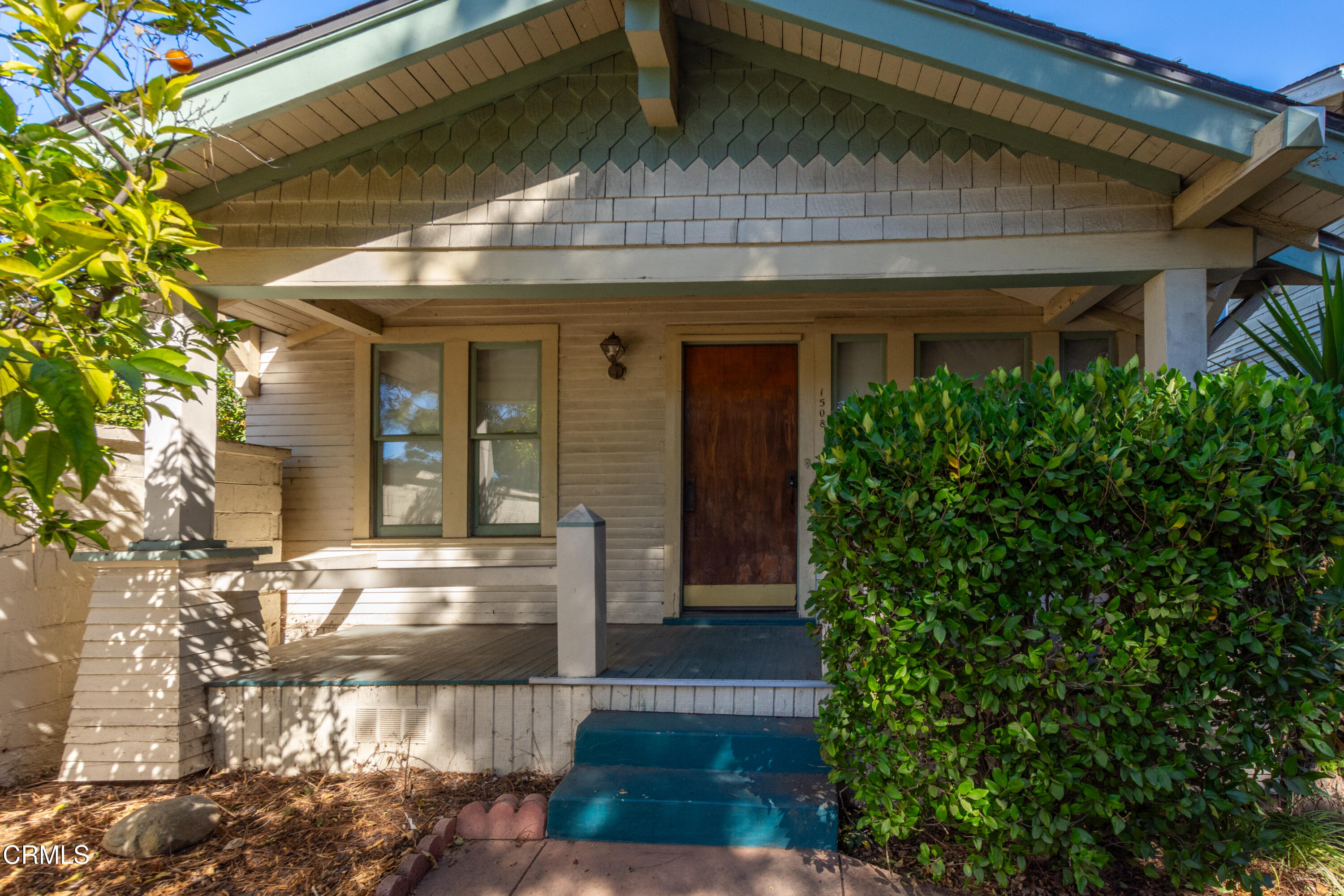 a front view of a house with a porch