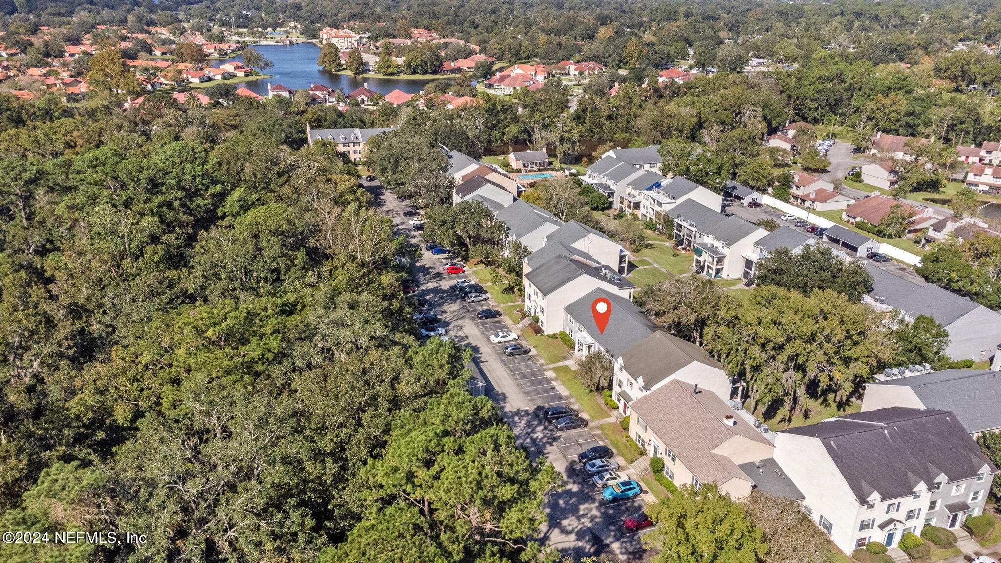 an aerial view of residential houses with outdoor space