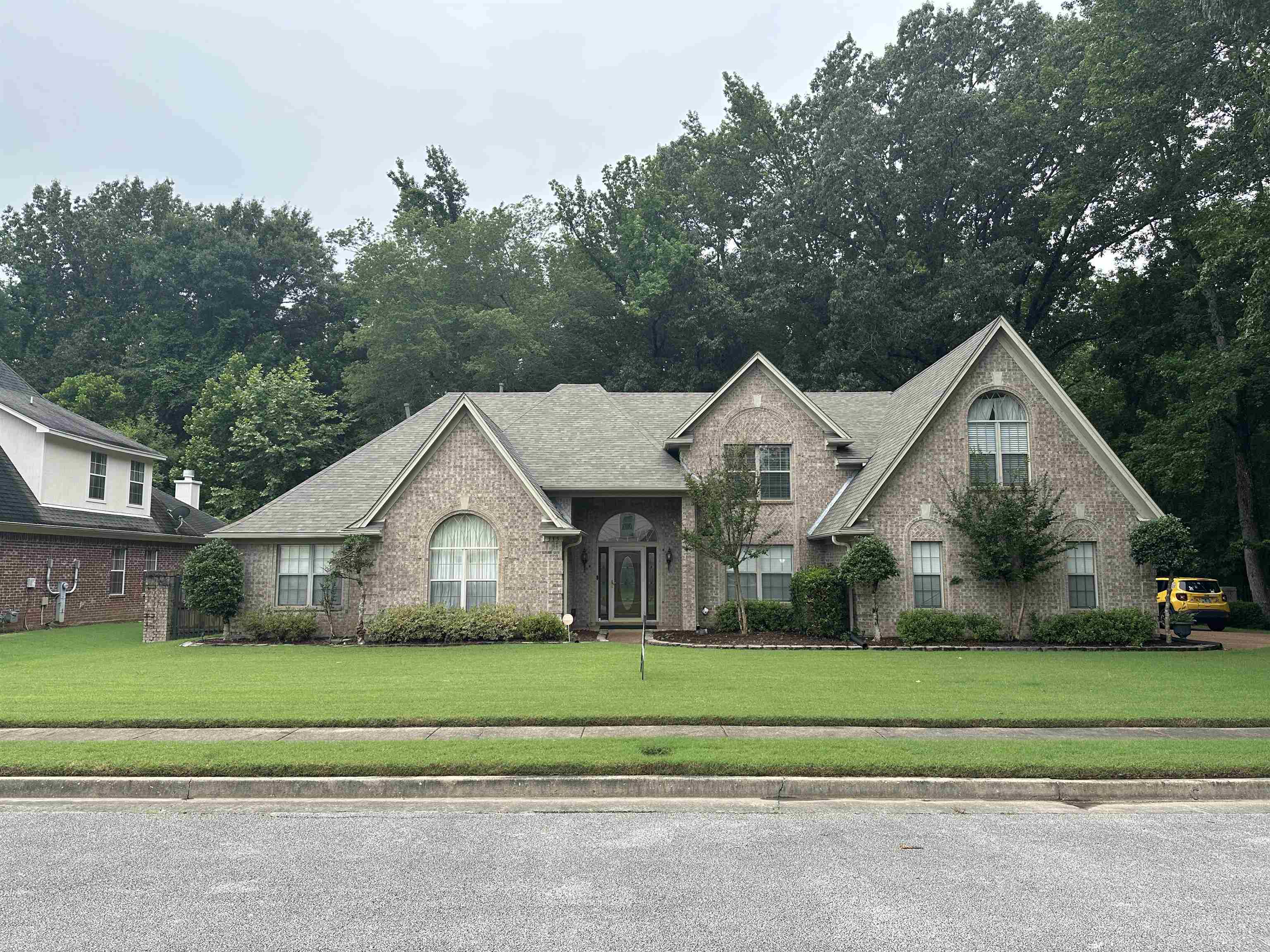 a front view of a house with a yard