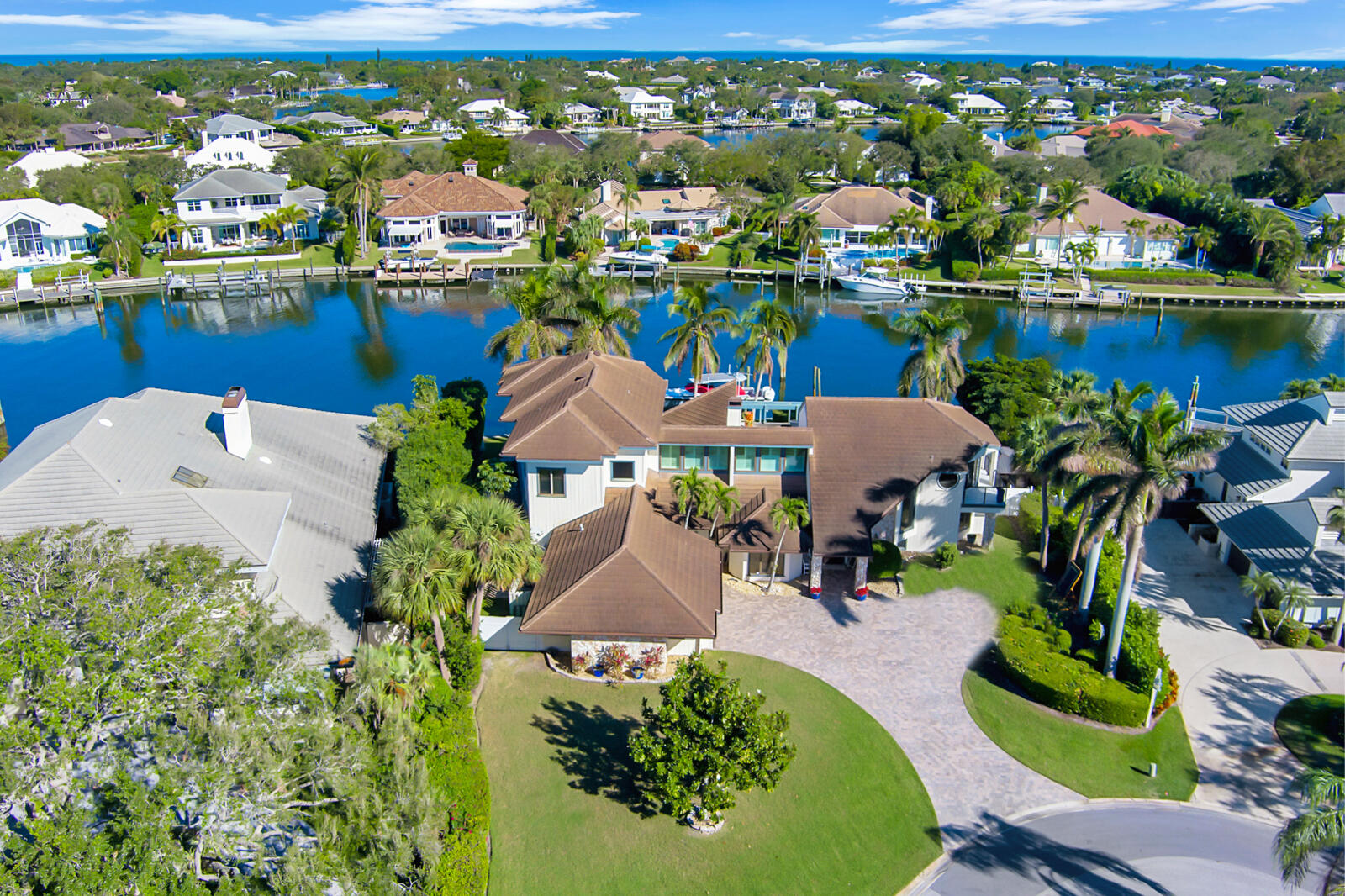 an aerial view of a house with a lake view