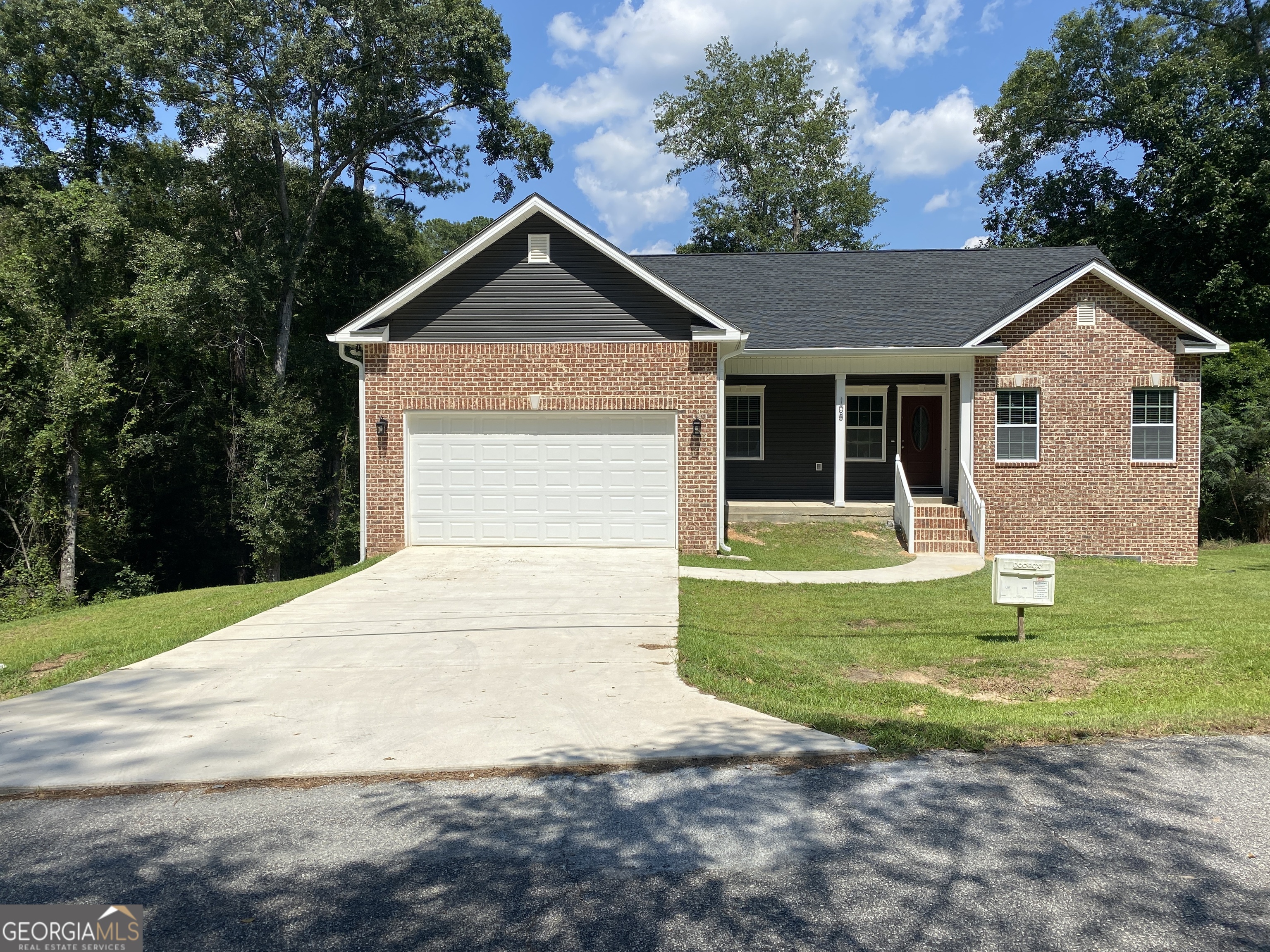 a front view of a house with a yard