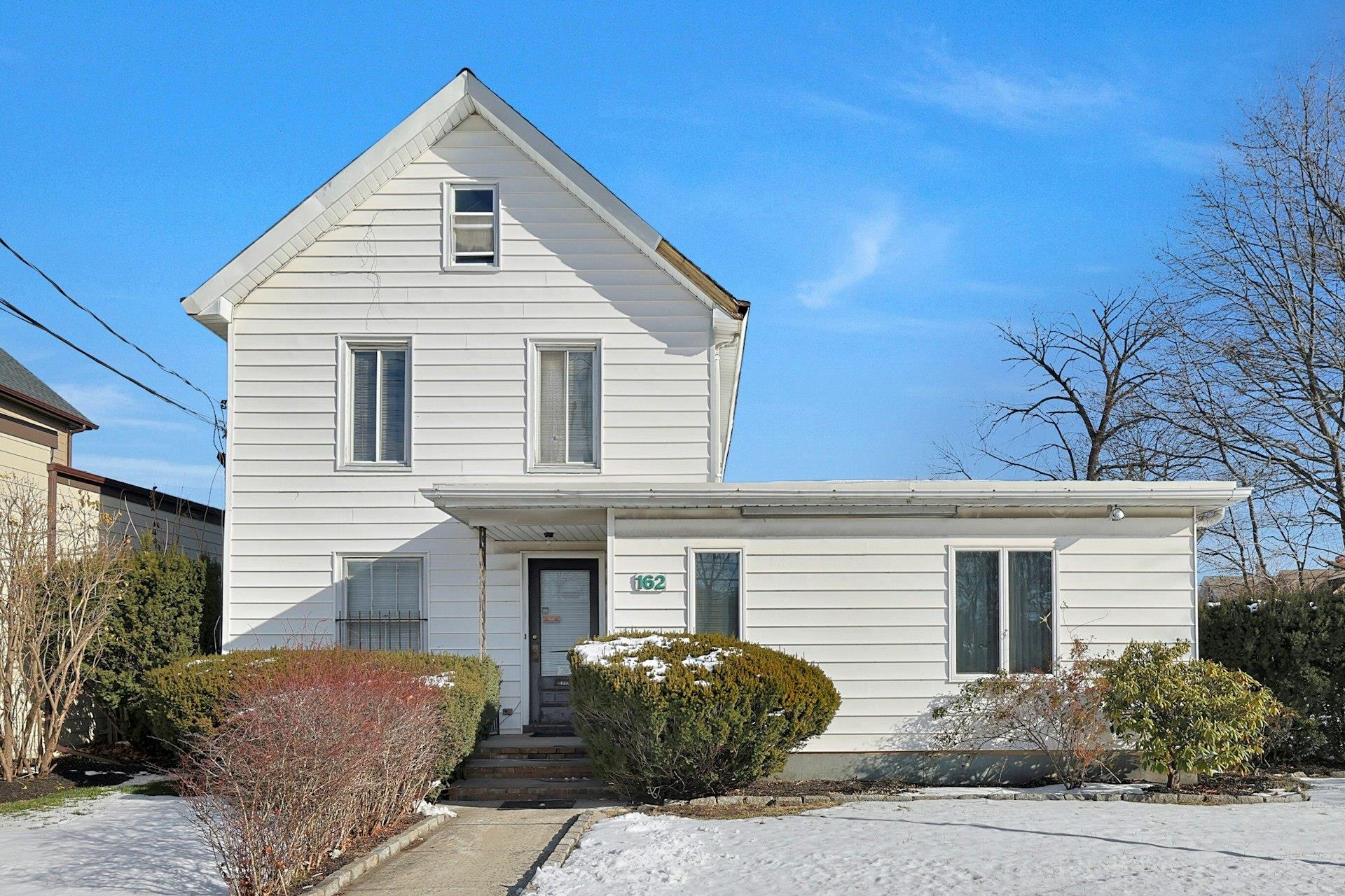 a front view of a house with a garage