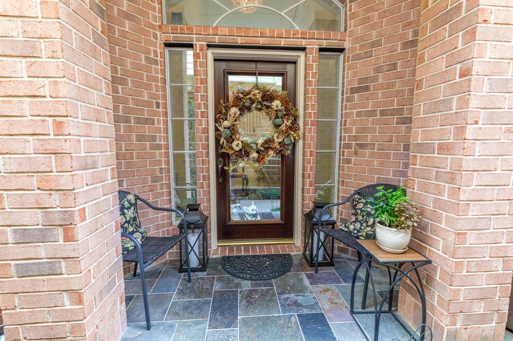 a front view of a house with outdoor seating