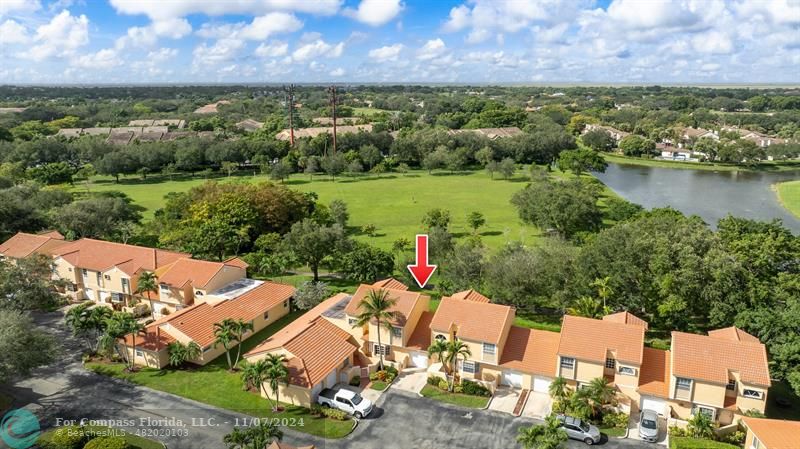 an aerial view of a house with a lake view