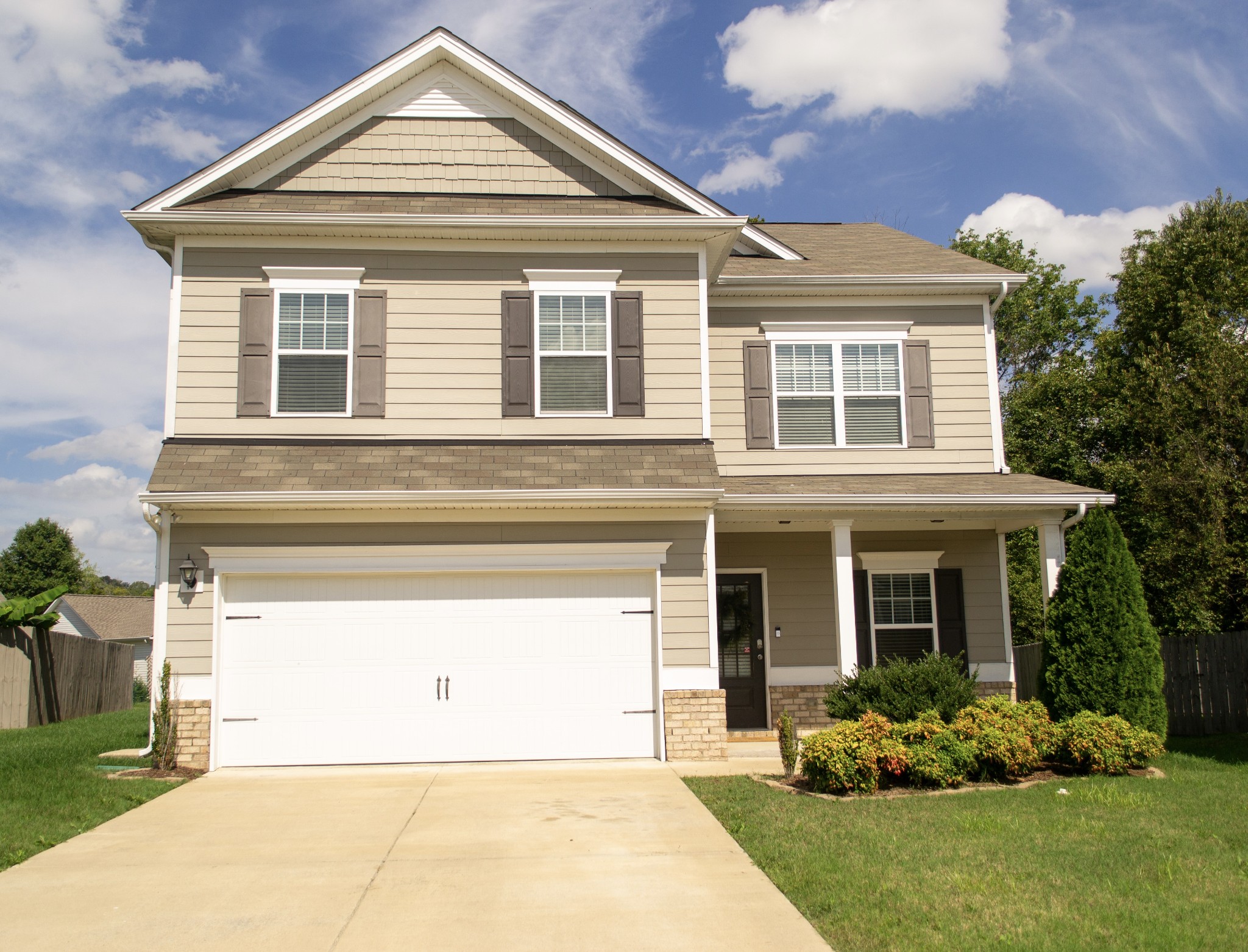 front view of a house with a yard