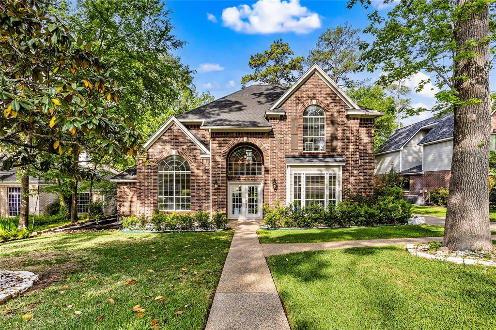 This timelessly classic brick home welcomes you.