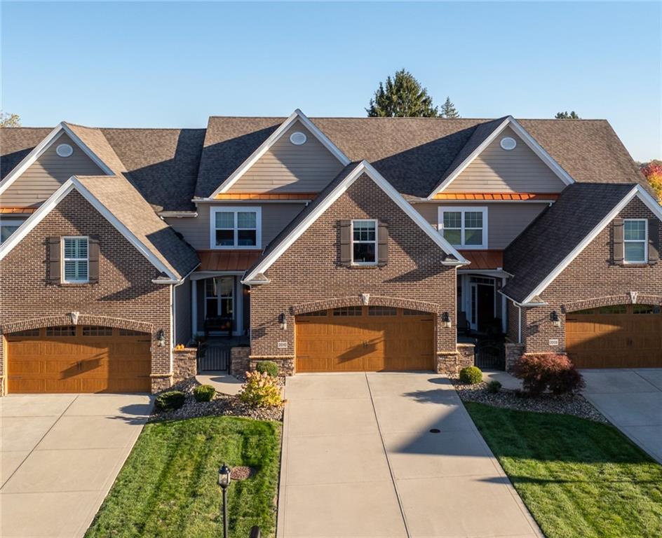 a front view of a house with yard