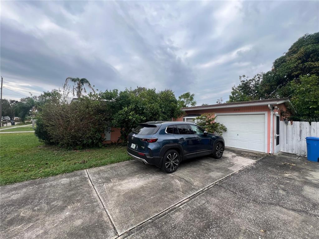 a car parked in front of a house