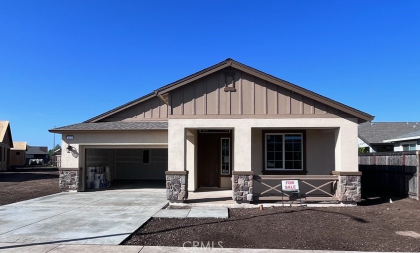 a front view of a house with yard