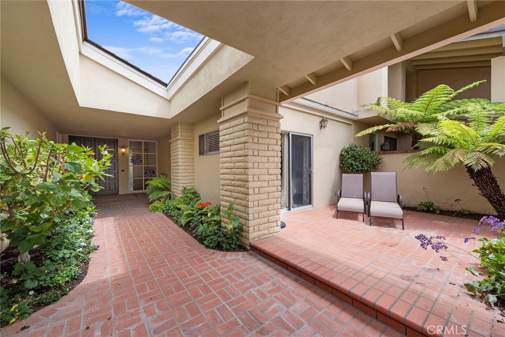 a house with potted plant in front of it