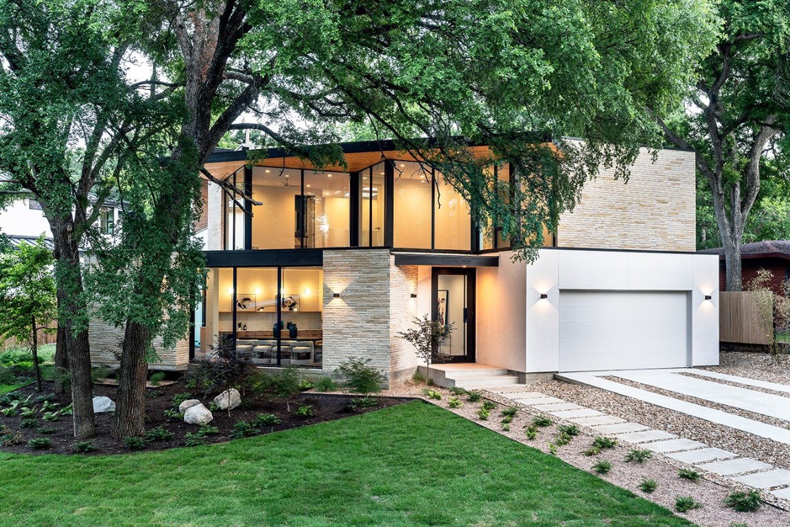 front view of a house with a garden