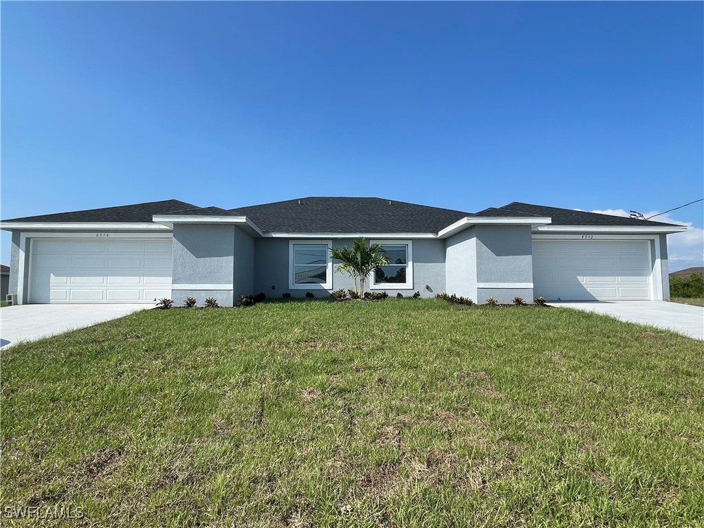 front view of a house with a yard