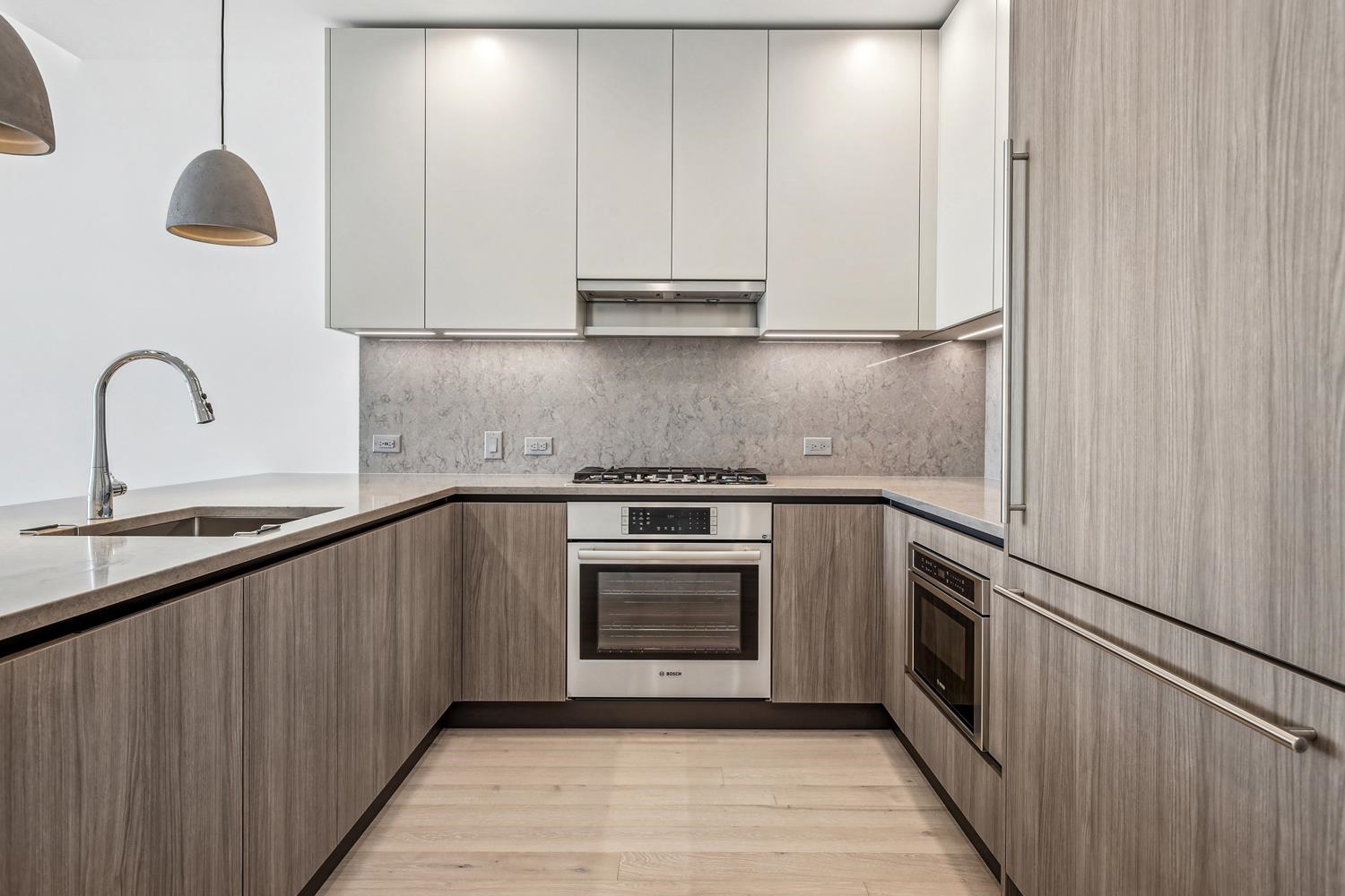 a kitchen with granite countertop a stove and a sink