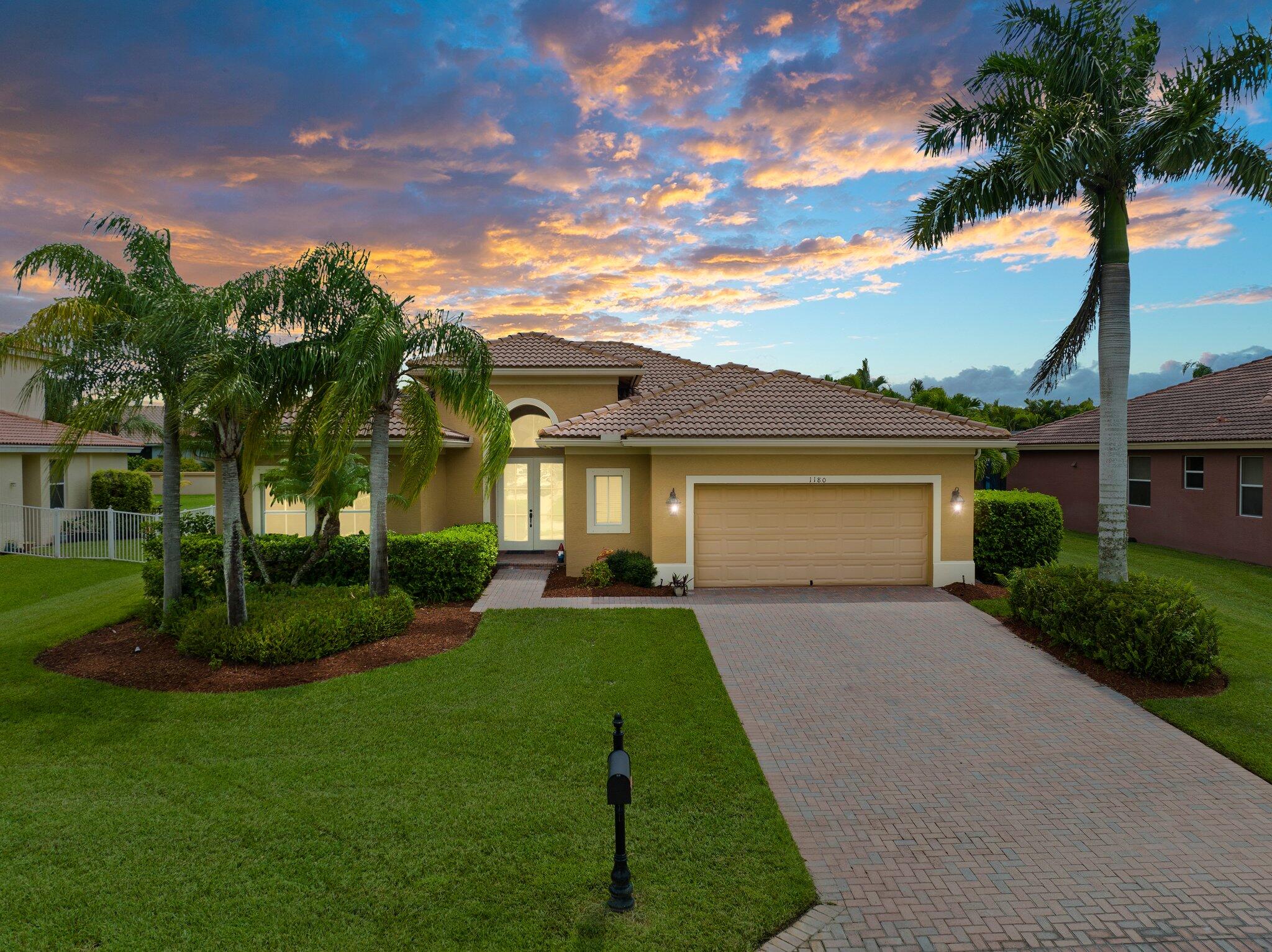 front view of a house with a yard