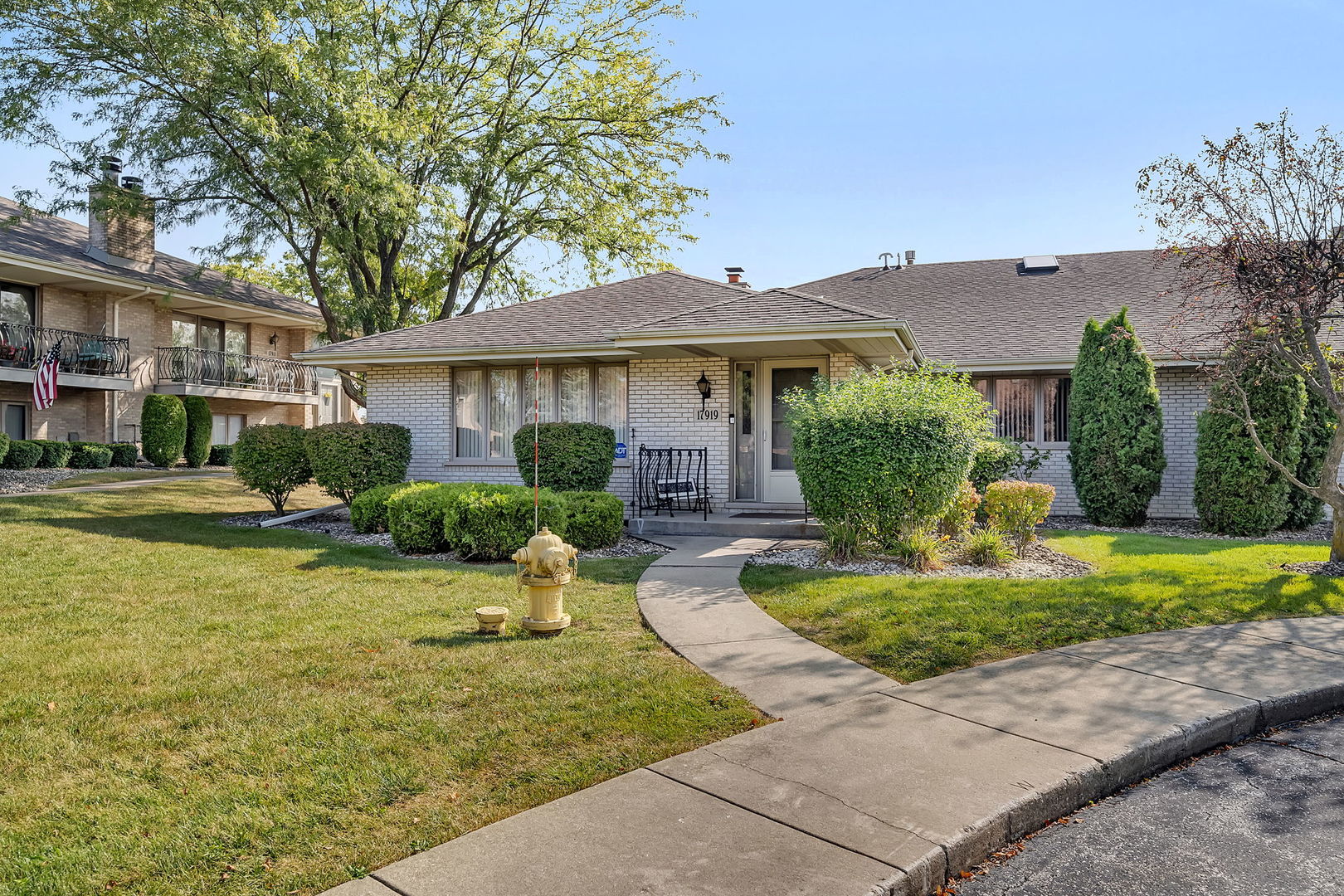 a front view of a house with a yard