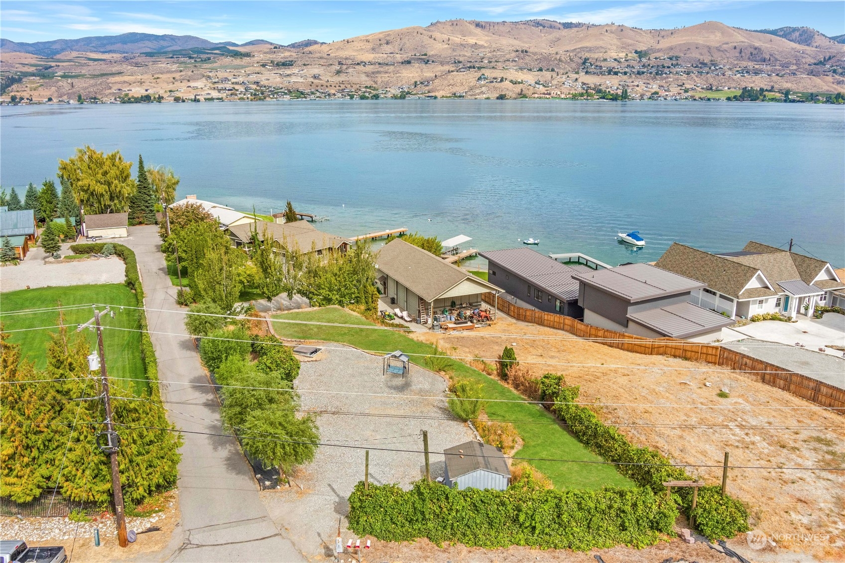 an aerial view of a house with a lake view