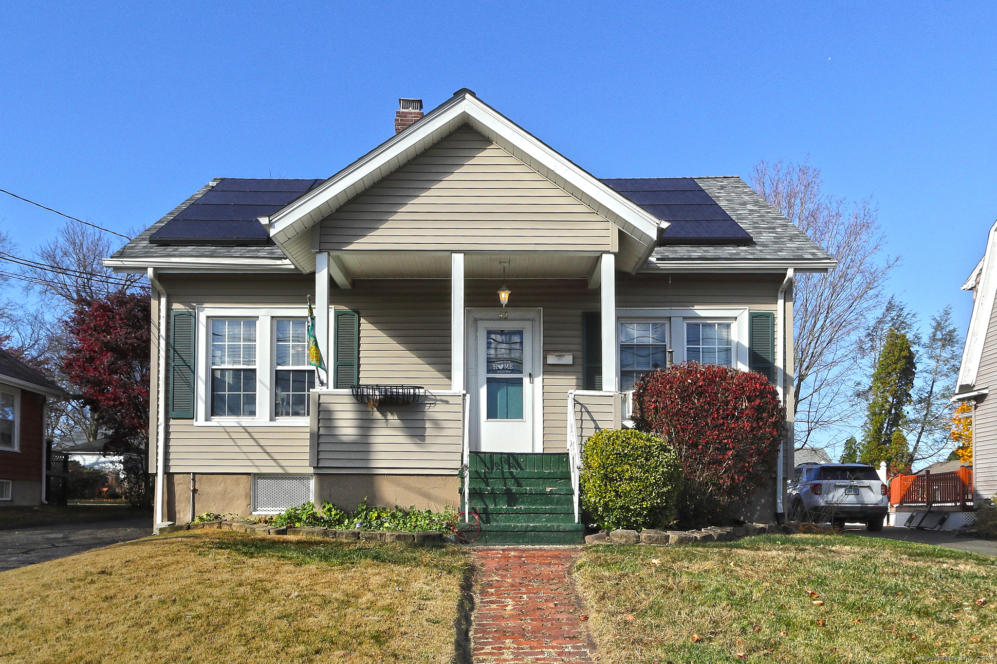 front view of a house with a yard