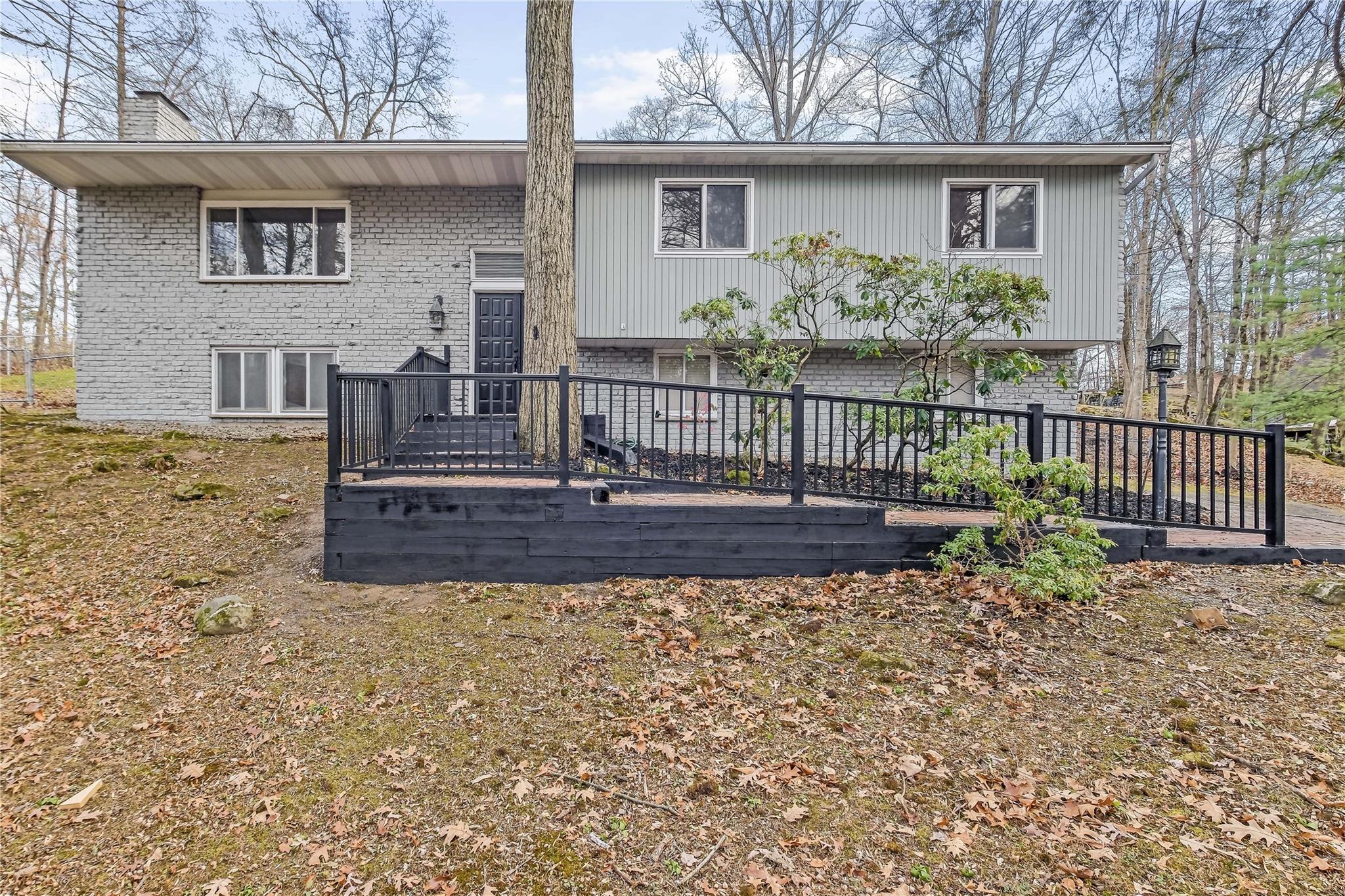 Rear view of property with a wooden deck