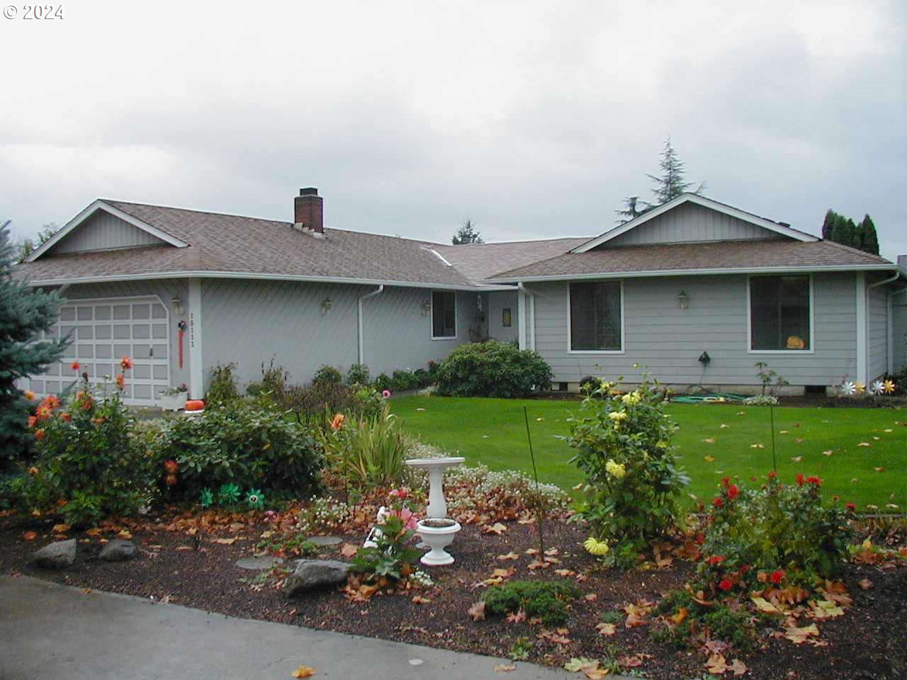 a front view of a house with garden