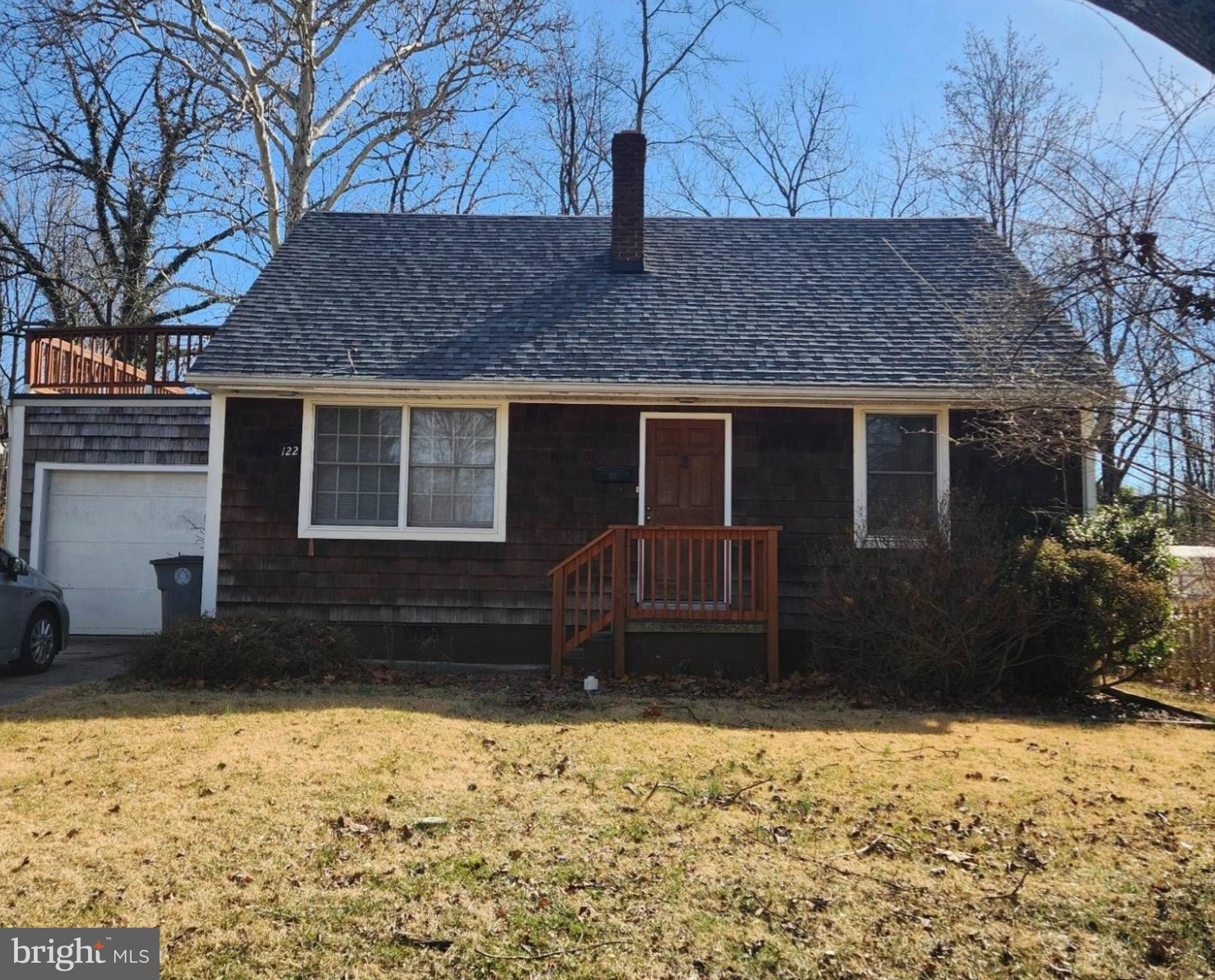 a house with trees in the background