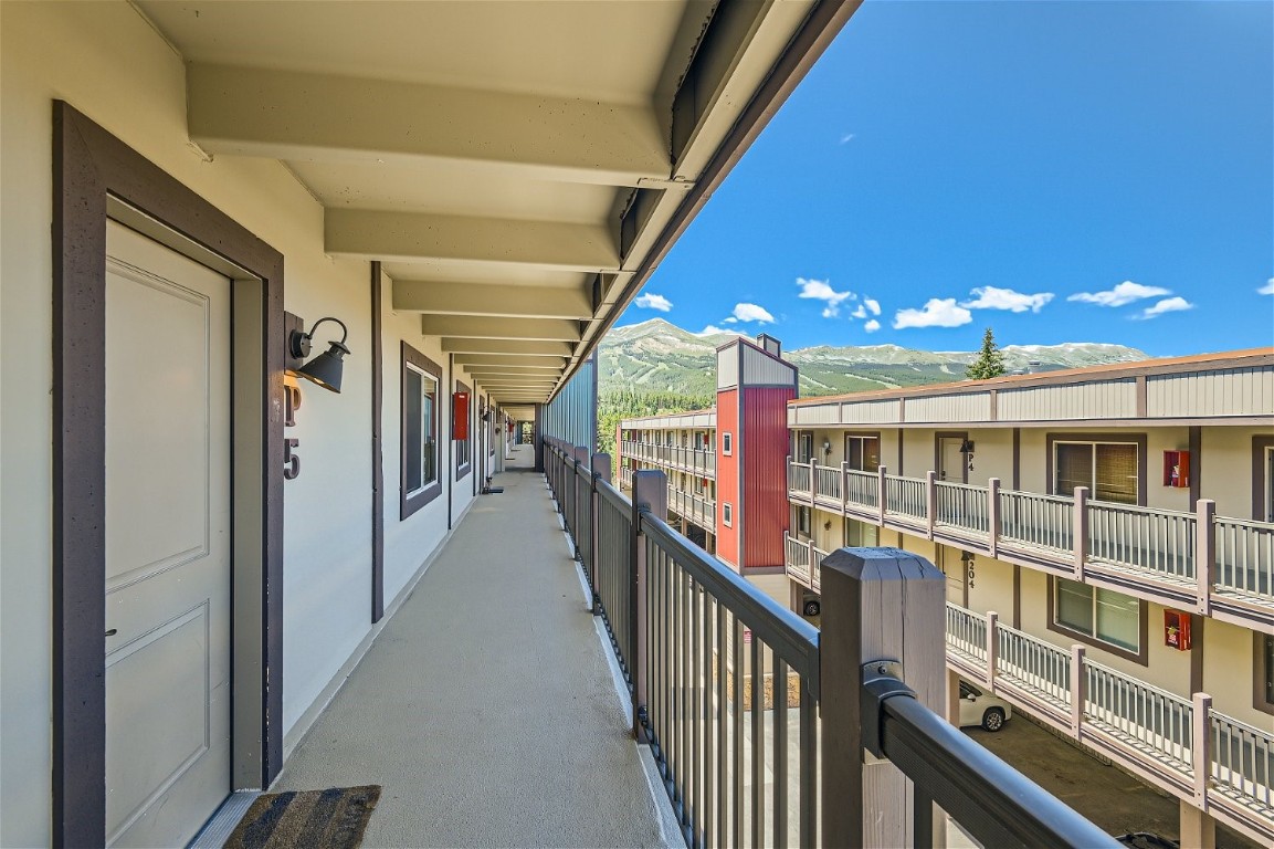 a view of a hallway with stairs