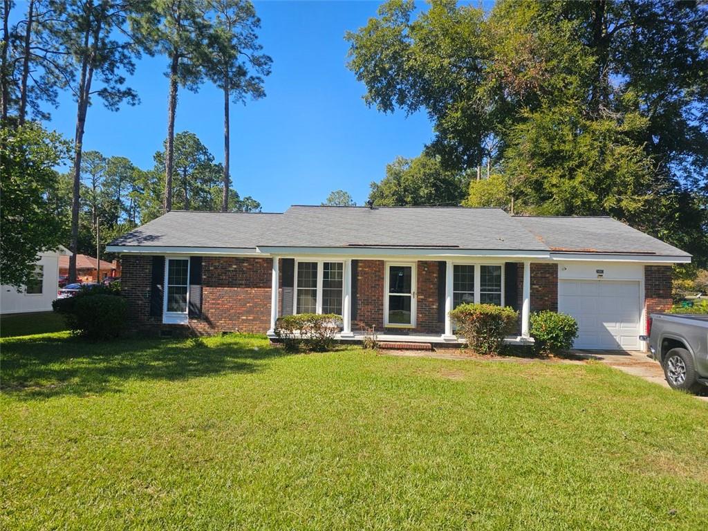 a front view of house with yard and green space