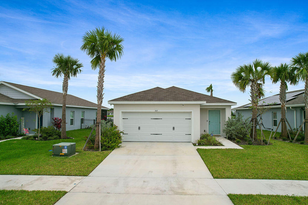 front view of a house with a yard