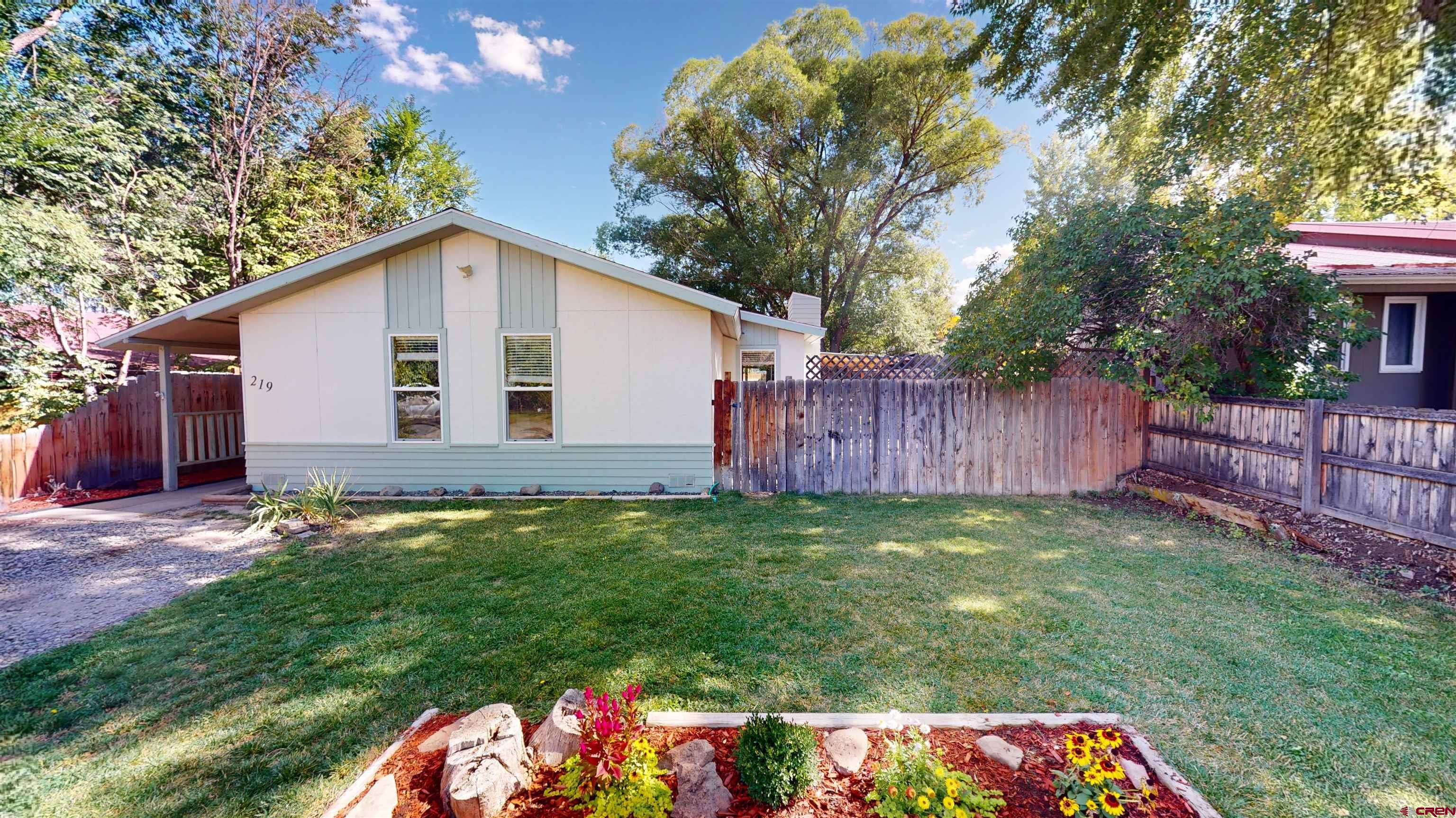 a backyard of a house with lots of green space