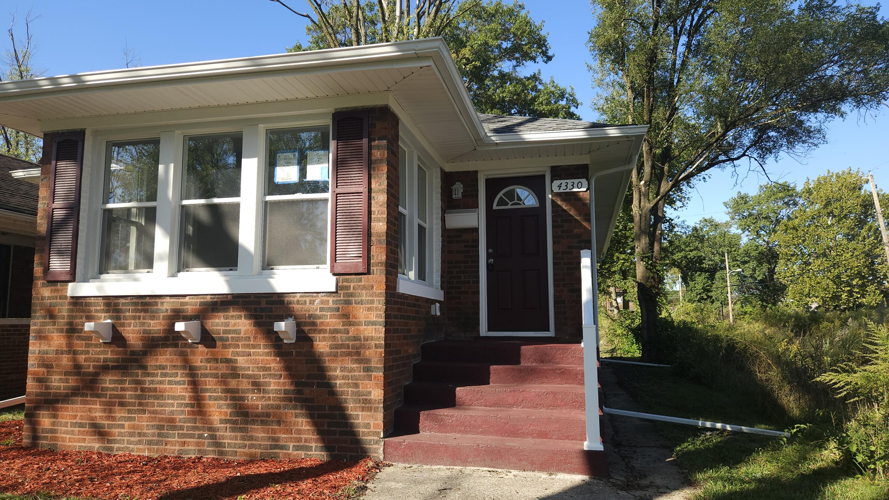 a front view of a house with a porch