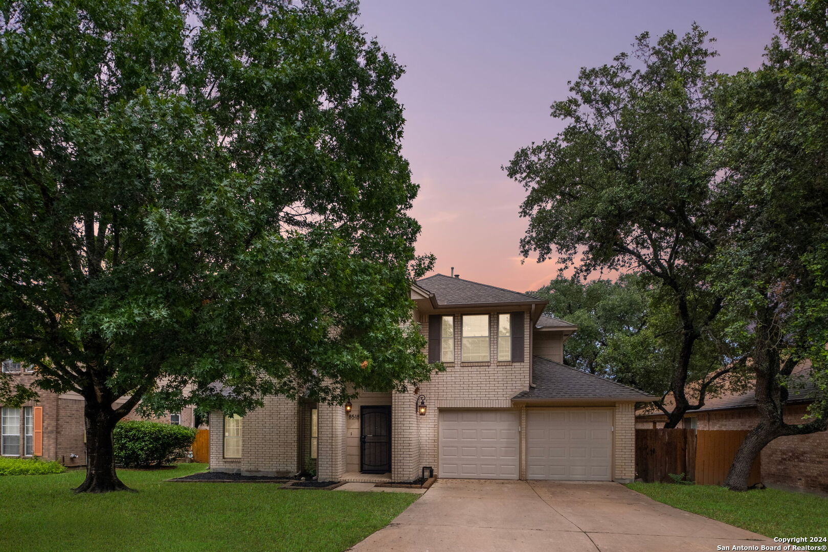 front view of a house with a garden