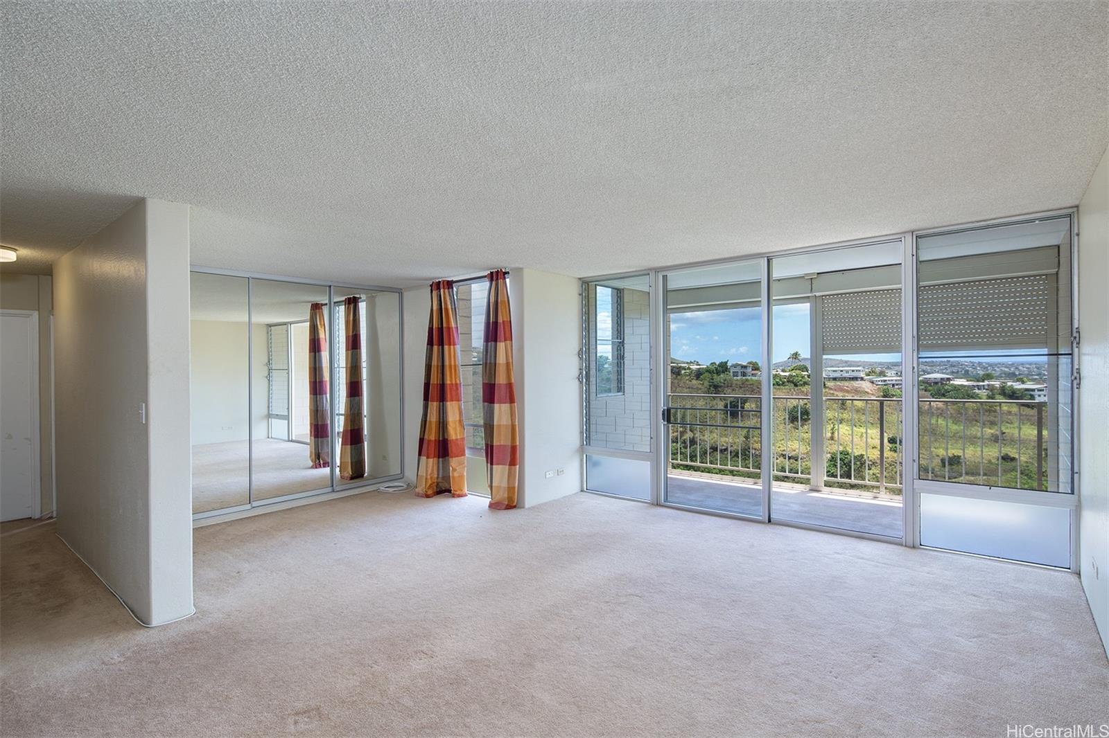 a view of an empty room with glass door