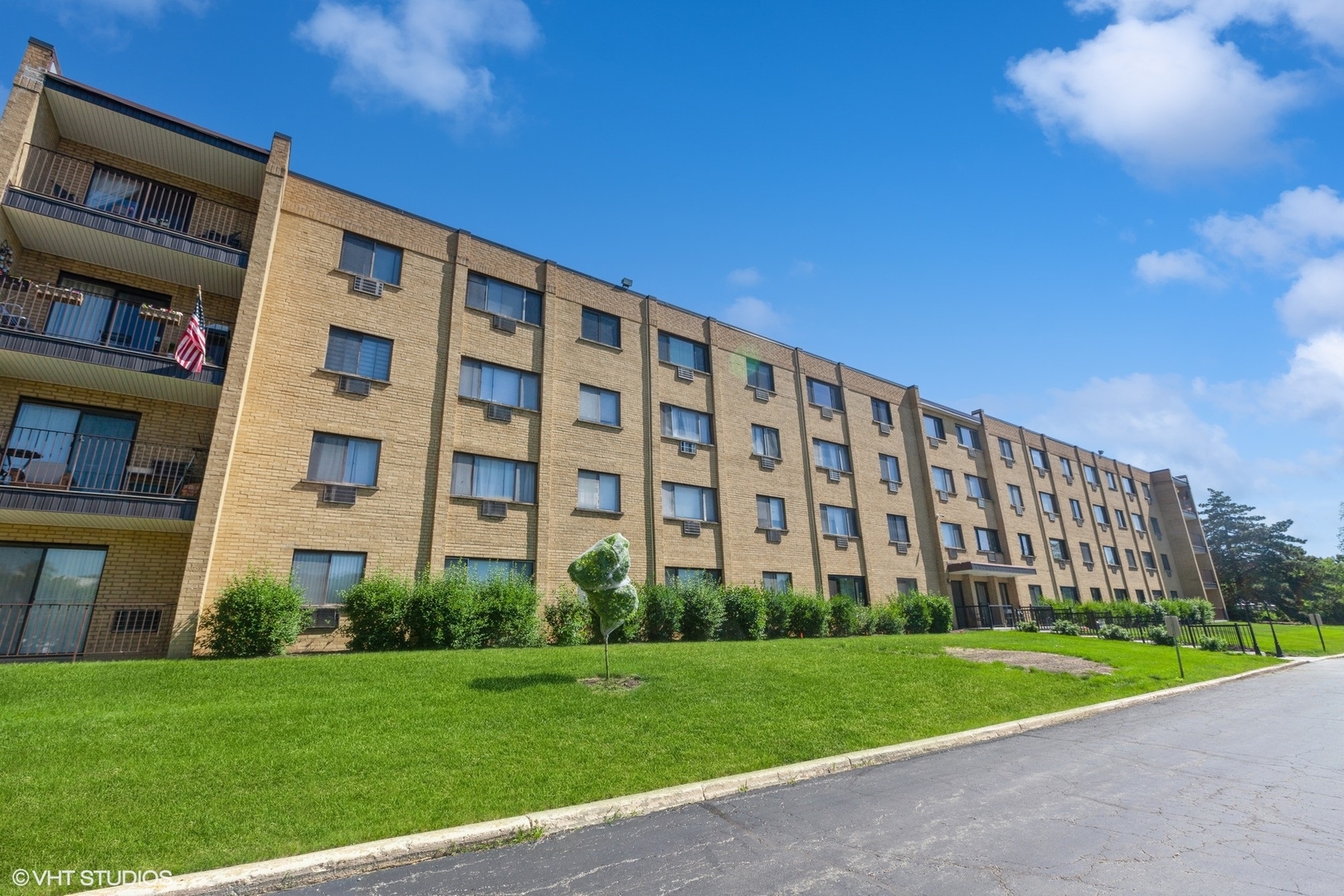 a view of a building with a yard