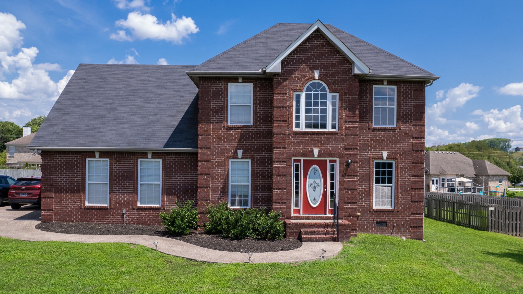 a front view of a house with a yard