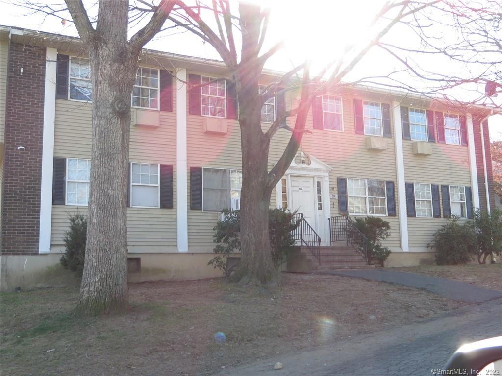 a front view of a house with yard