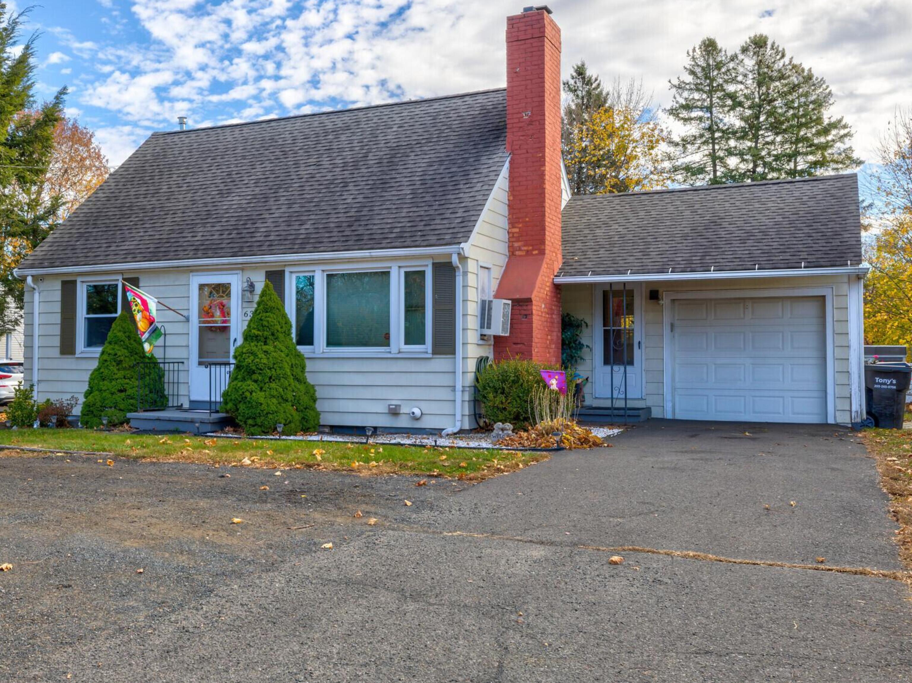 front view of house with potted plants