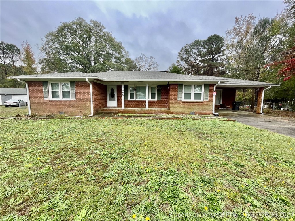 a house that has a tree in front of it