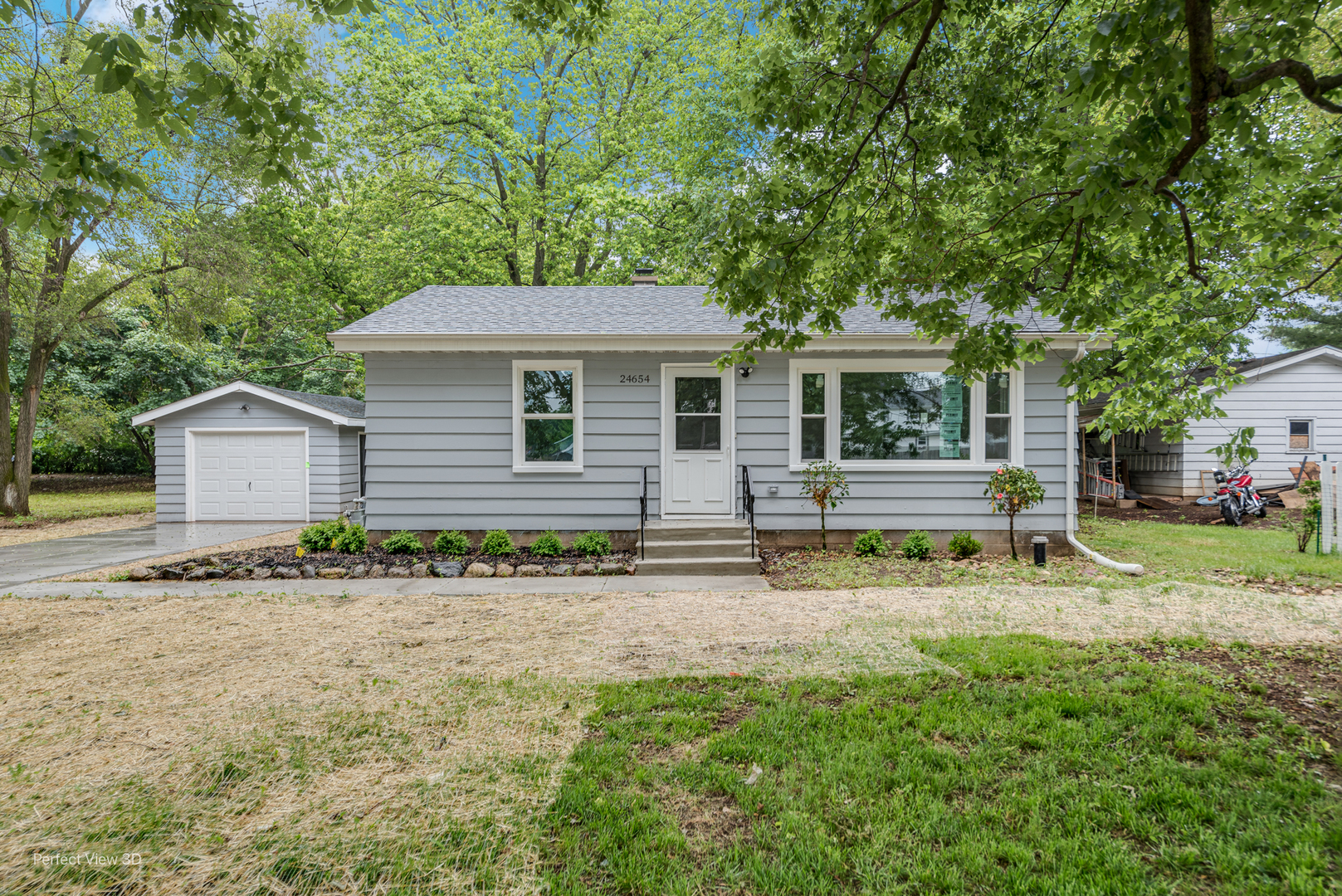 front view of a house with a yard