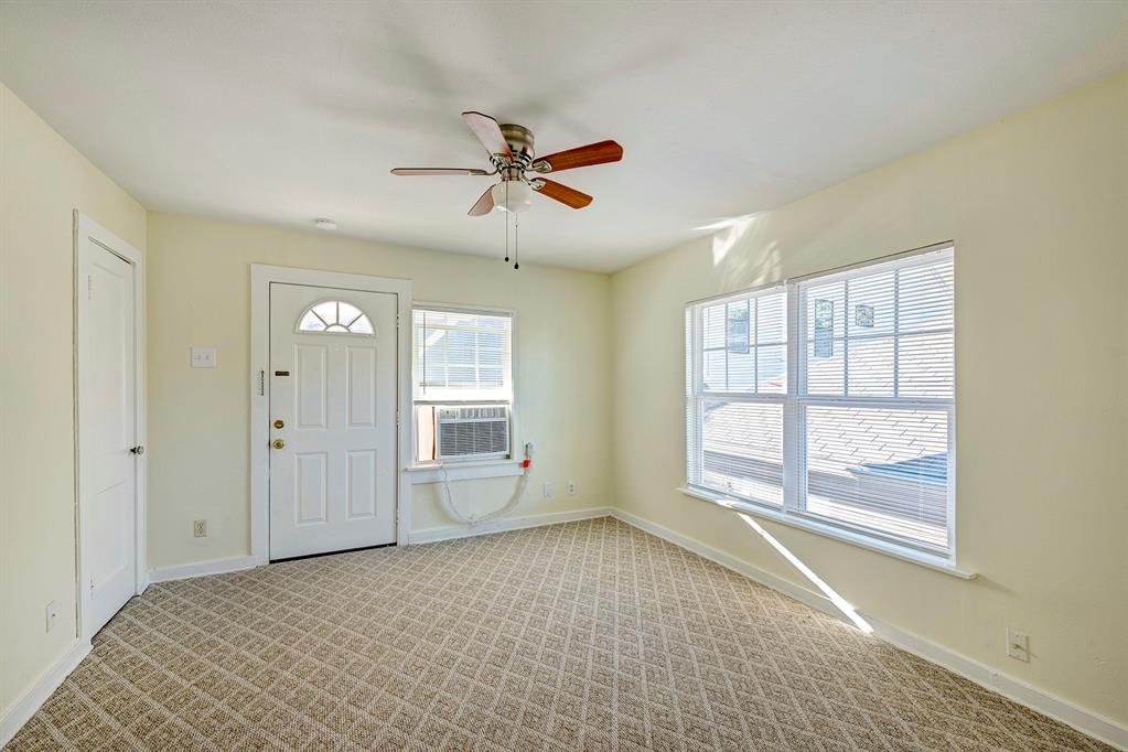 a view of an empty room with a window