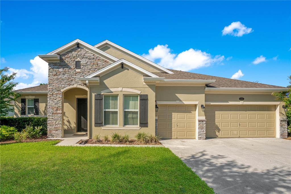 front view of a house with a yard