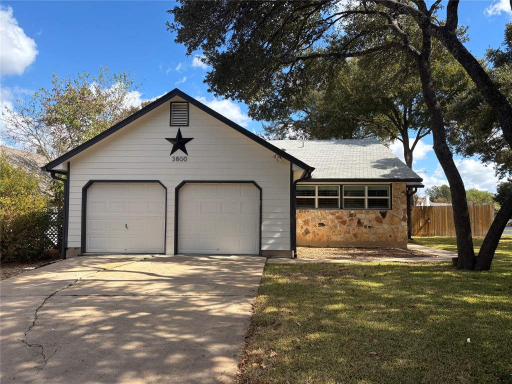 a house with trees in the background