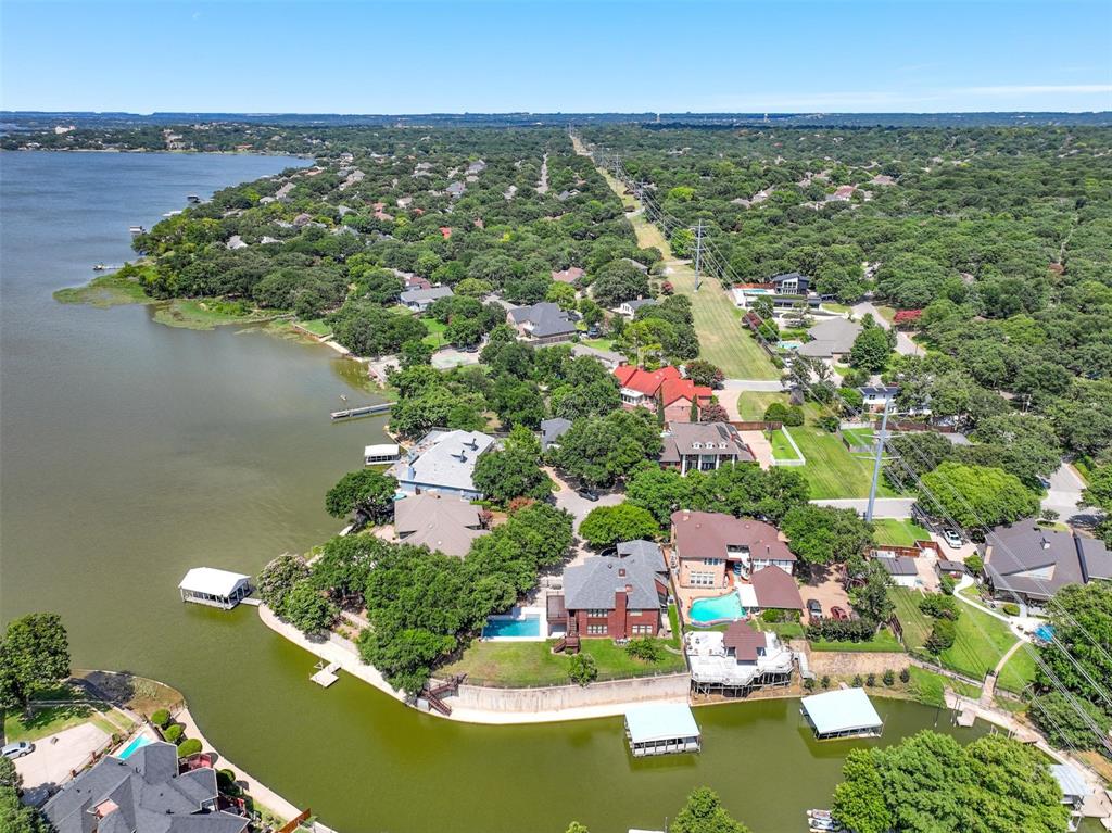 an aerial view of residential houses with outdoor space and swimming pool