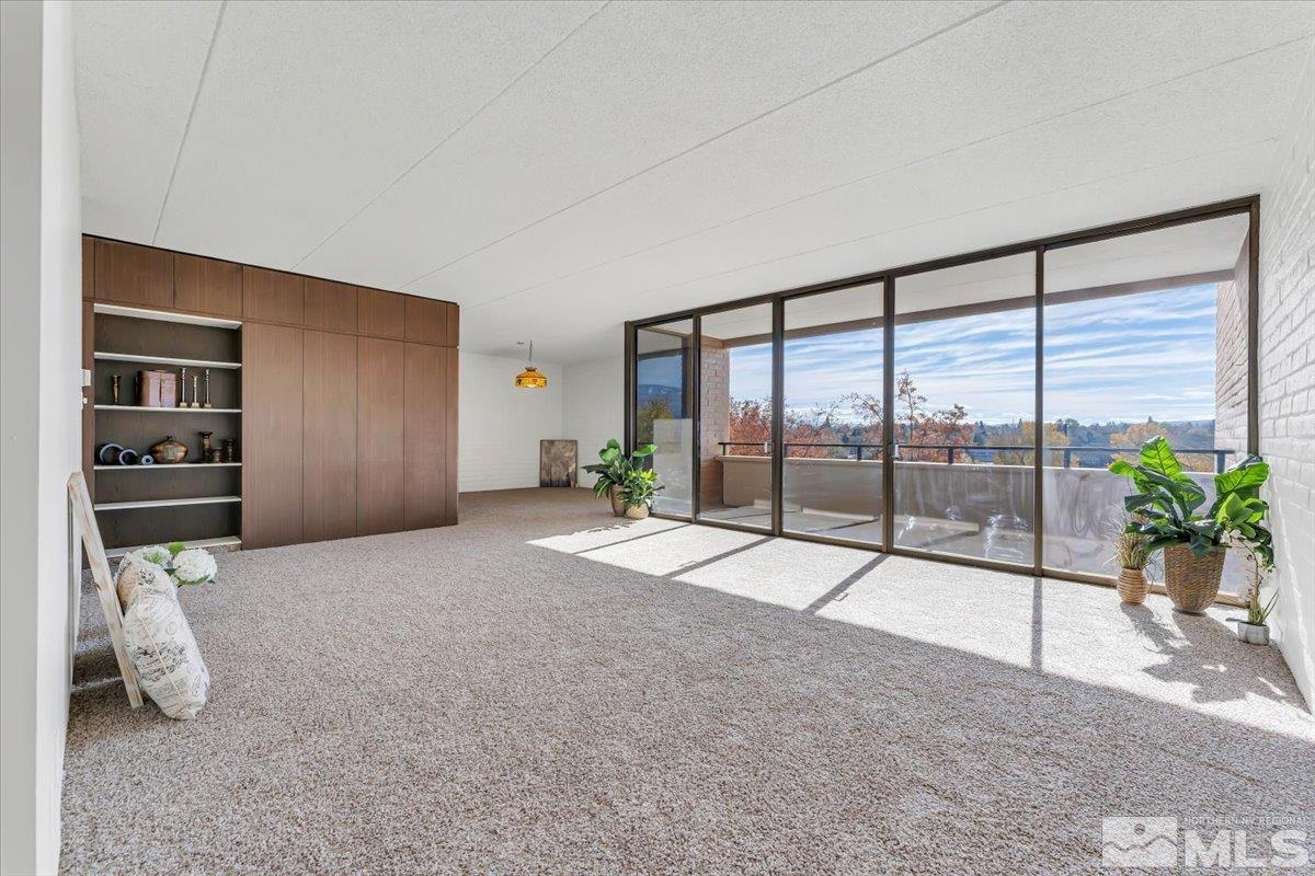 a view of livingroom with floor to ceiling window with outer view