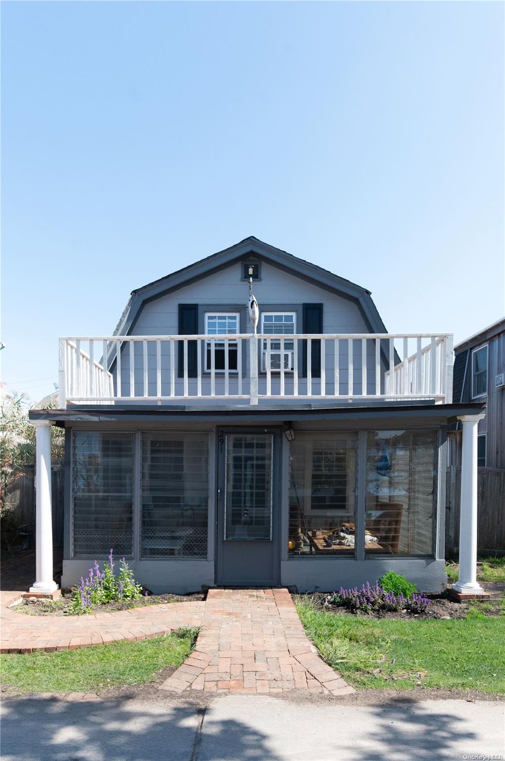 a front view of a house with a yard and a garage