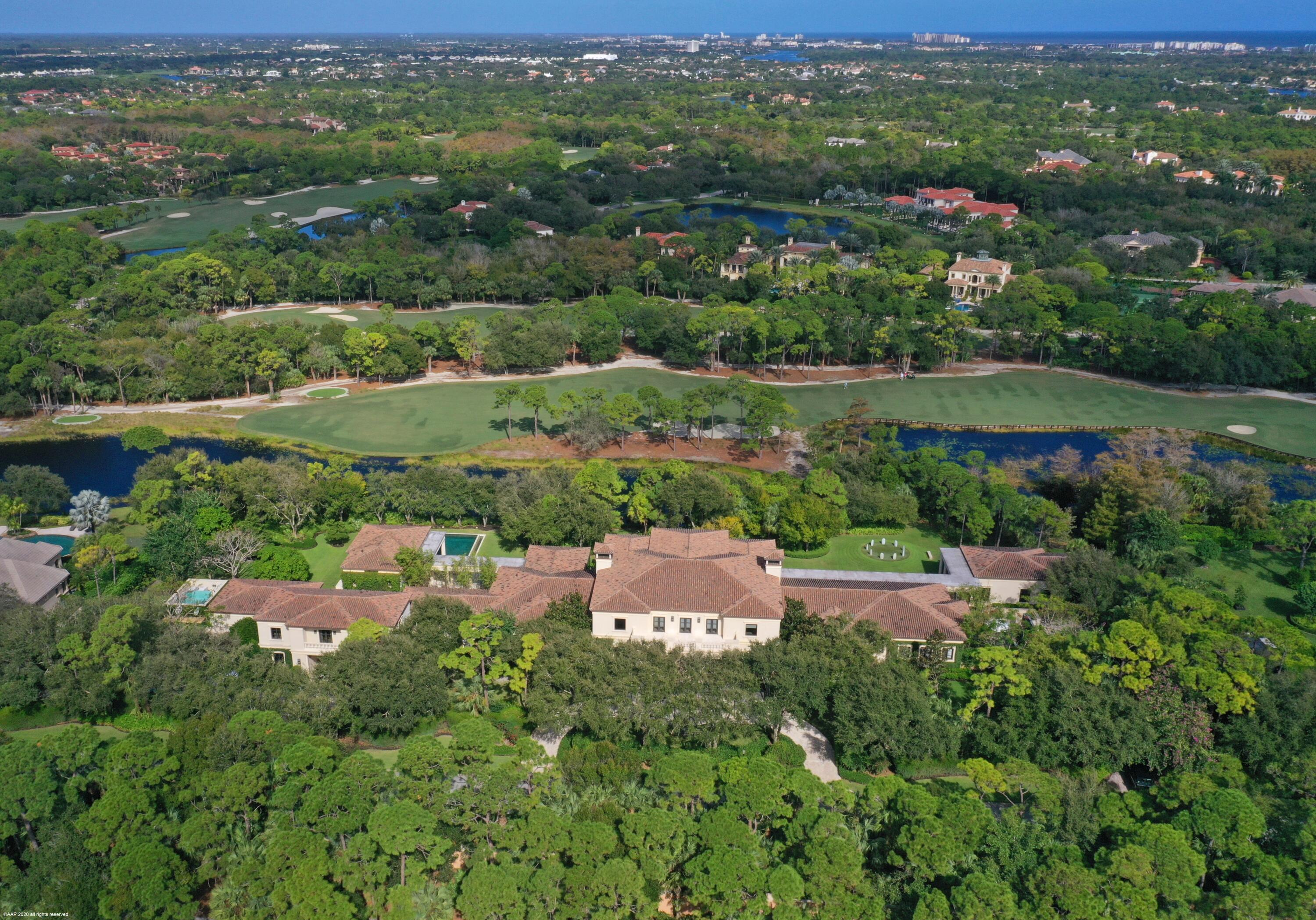 an aerial view of city residential houses with outdoor space and trees