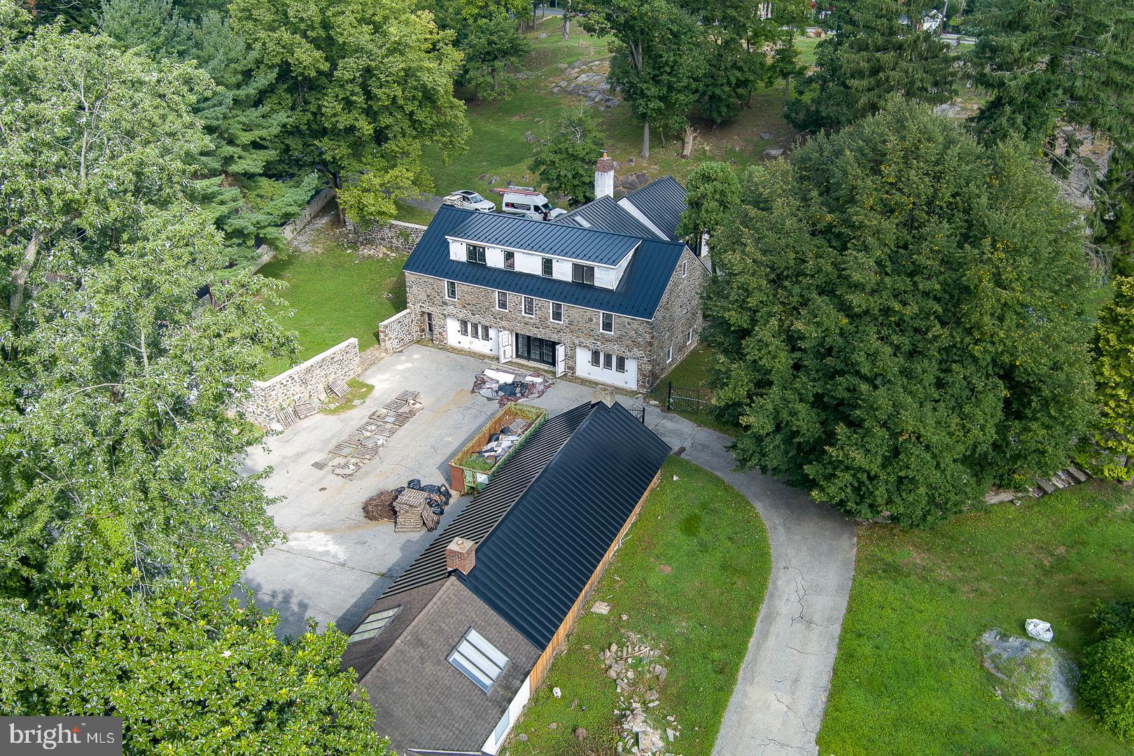 an aerial view of a house with a garden