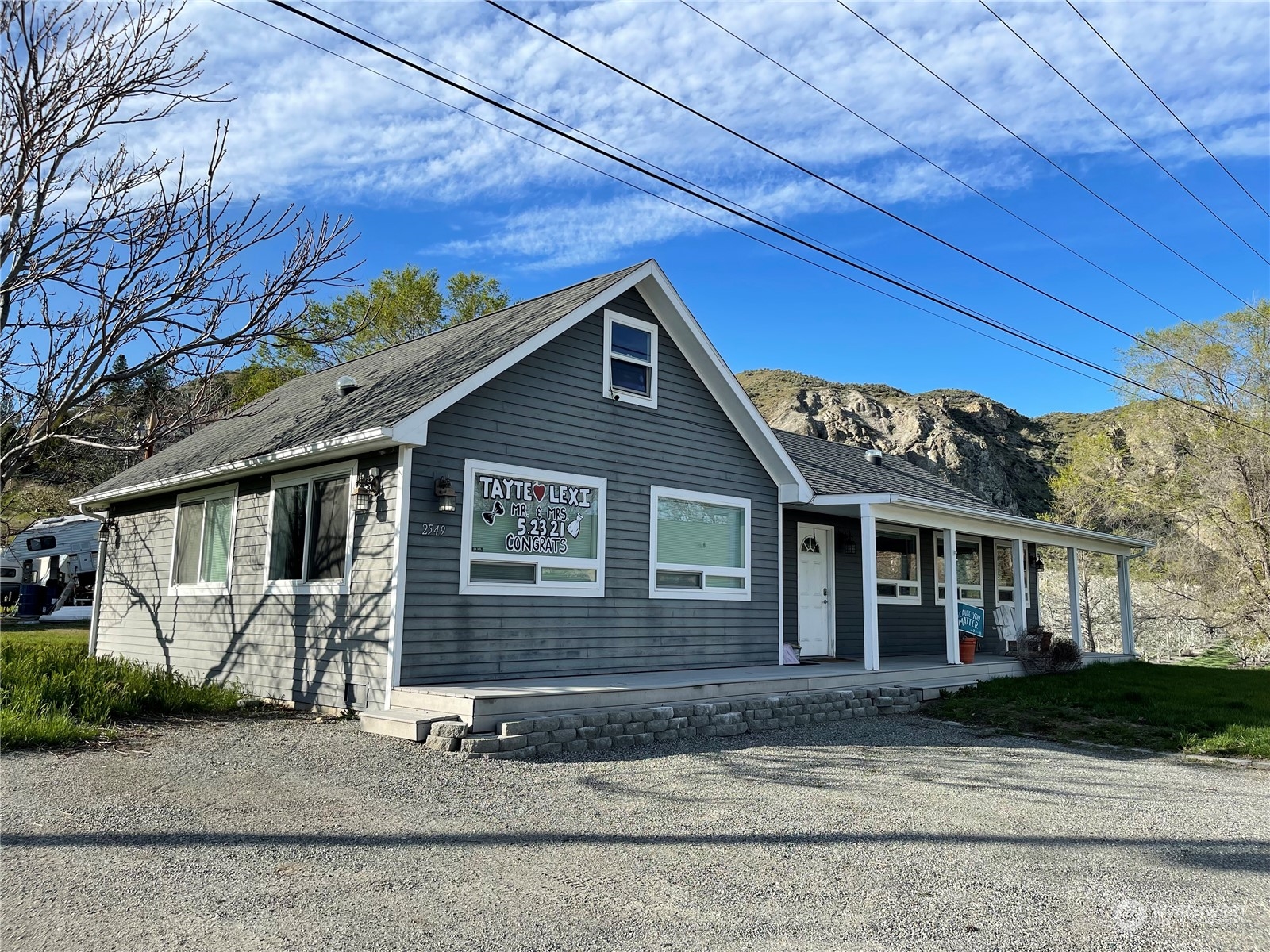 a front view of a house with a yard