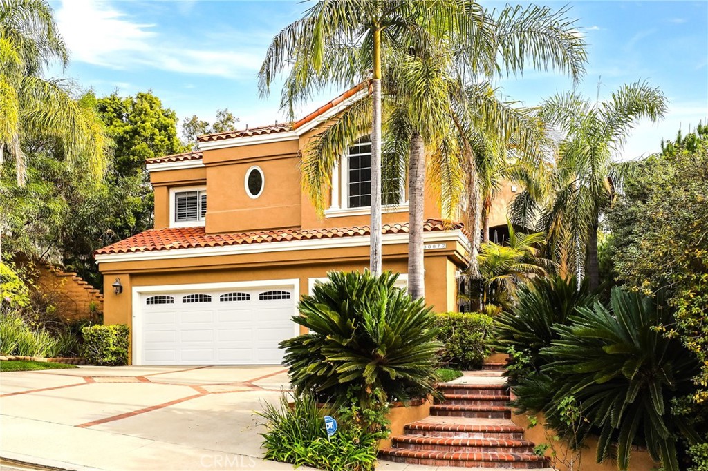 a front view of a house with a garage