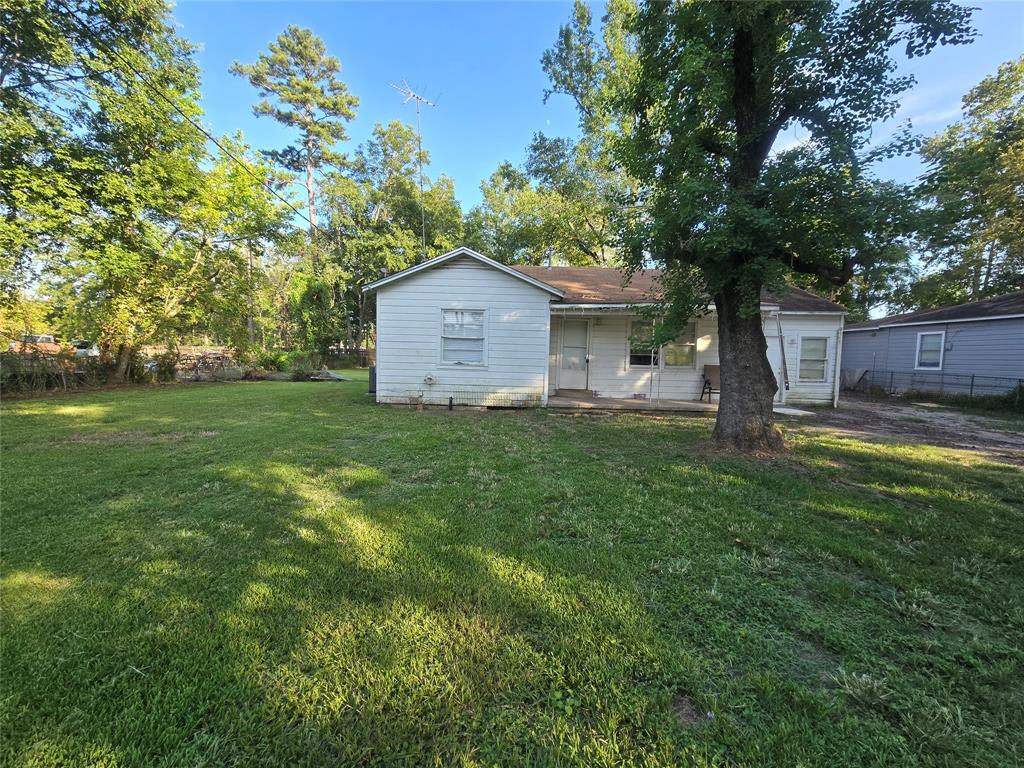 a front view of a house with a garden and yard