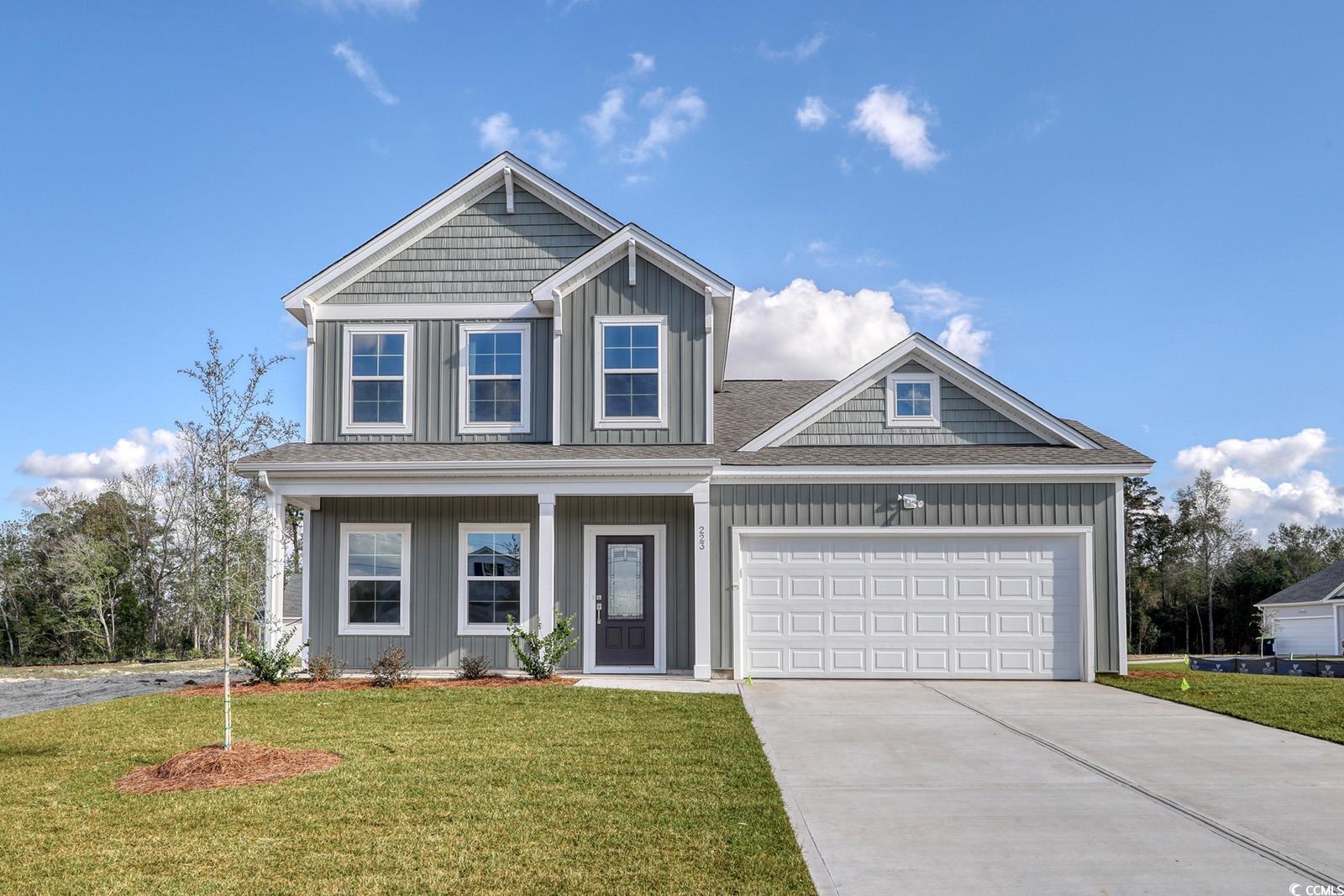 View of front of property featuring a front yard a