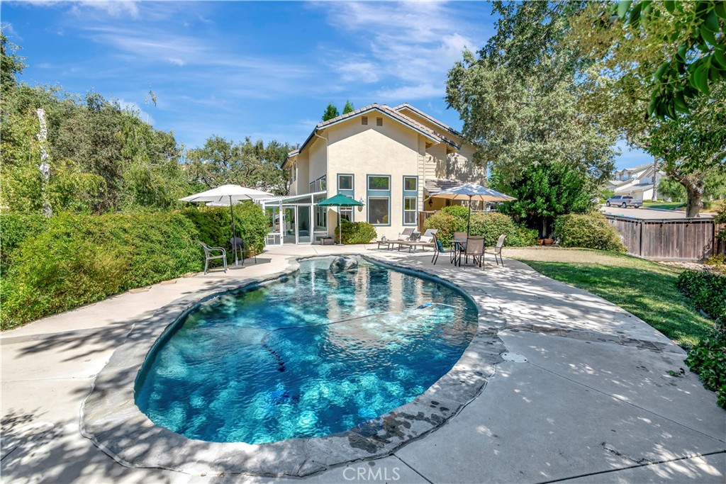 a view of a swimming pool with a patio